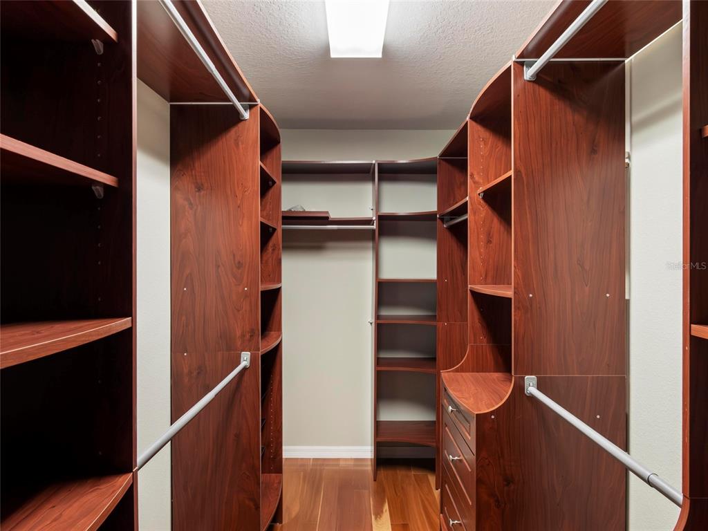 512 Bella Rosa Circle Sanford, FL 32771 - Photo 23 of 31 a view of walk in closet with wooden floor