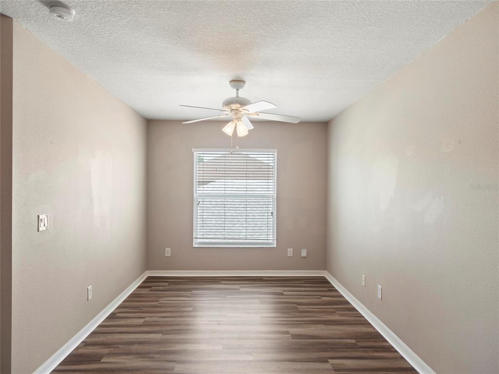 512 Bella Rosa Circle Sanford, FL 32771 - Photo 25 of 31 wooden floor in an empty room with a window