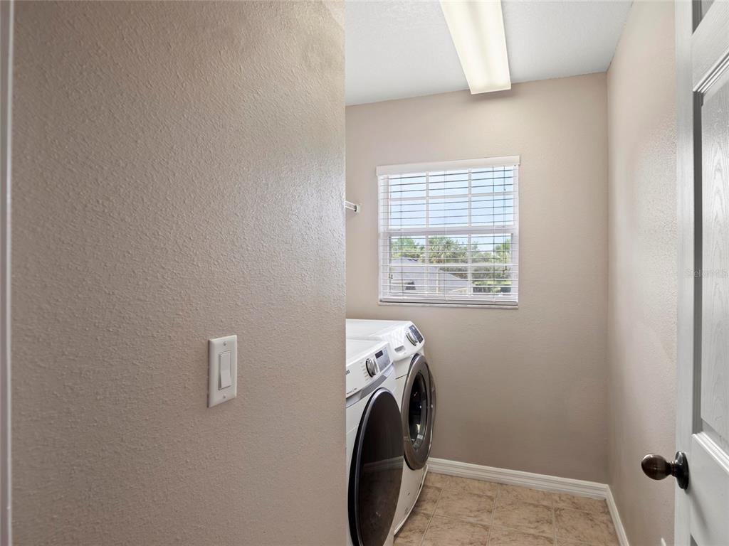 512 Bella Rosa Circle Sanford, FL 32771 - Photo 28 of 31 a utility room with dryer and washer