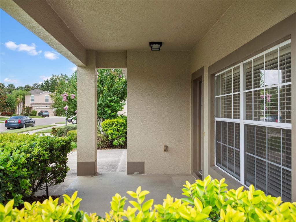 512 Bella Rosa Circle Sanford, FL 32771 - Photo 3 of 31 a view of a garden with a chair