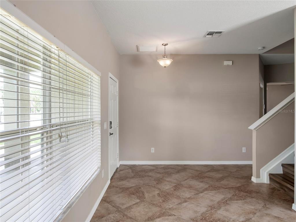 512 Bella Rosa Circle Sanford, FL 32771 - Photo 4 of 31 a view of a hallway with a window