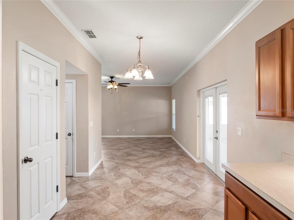 512 Bella Rosa Circle Sanford, FL 32771 - Photo 9 of 31 wooden floor in an empty room with a window
