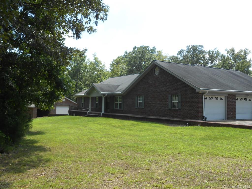1883 Potter Road Lancaster, SC 29720 - Photo 1 of 17 a house with a tree in front of it