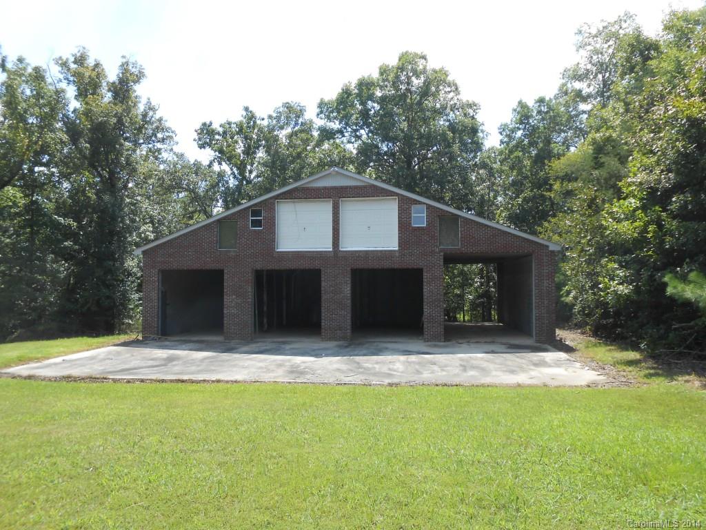 1883 Potter Road Lancaster, SC 29720 - Photo 14 of 17 a house with trees in the background
