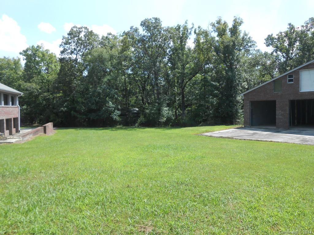 1883 Potter Road Lancaster, SC 29720 - Photo 15 of 17 a swimming pool with outdoor seating and yard