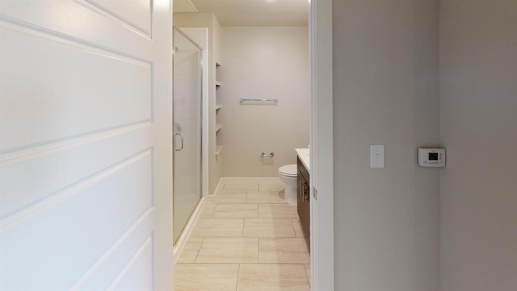 1500 North Haskell Avenue, Unit 1006 Dallas, TX 75204 - Photo 4 of 7 a view of a bathroom from a hallway