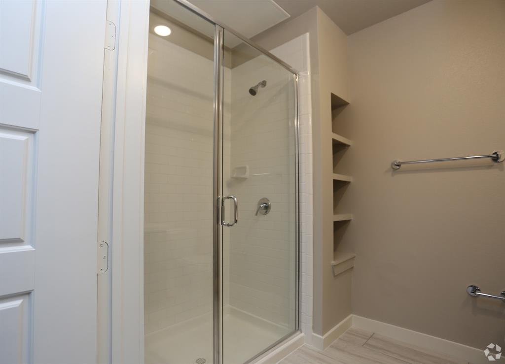 1500 North Haskell Avenue, Unit 1006 Dallas, TX 75204 - Photo 5 of 7 a bathroom with a shower and a glass door