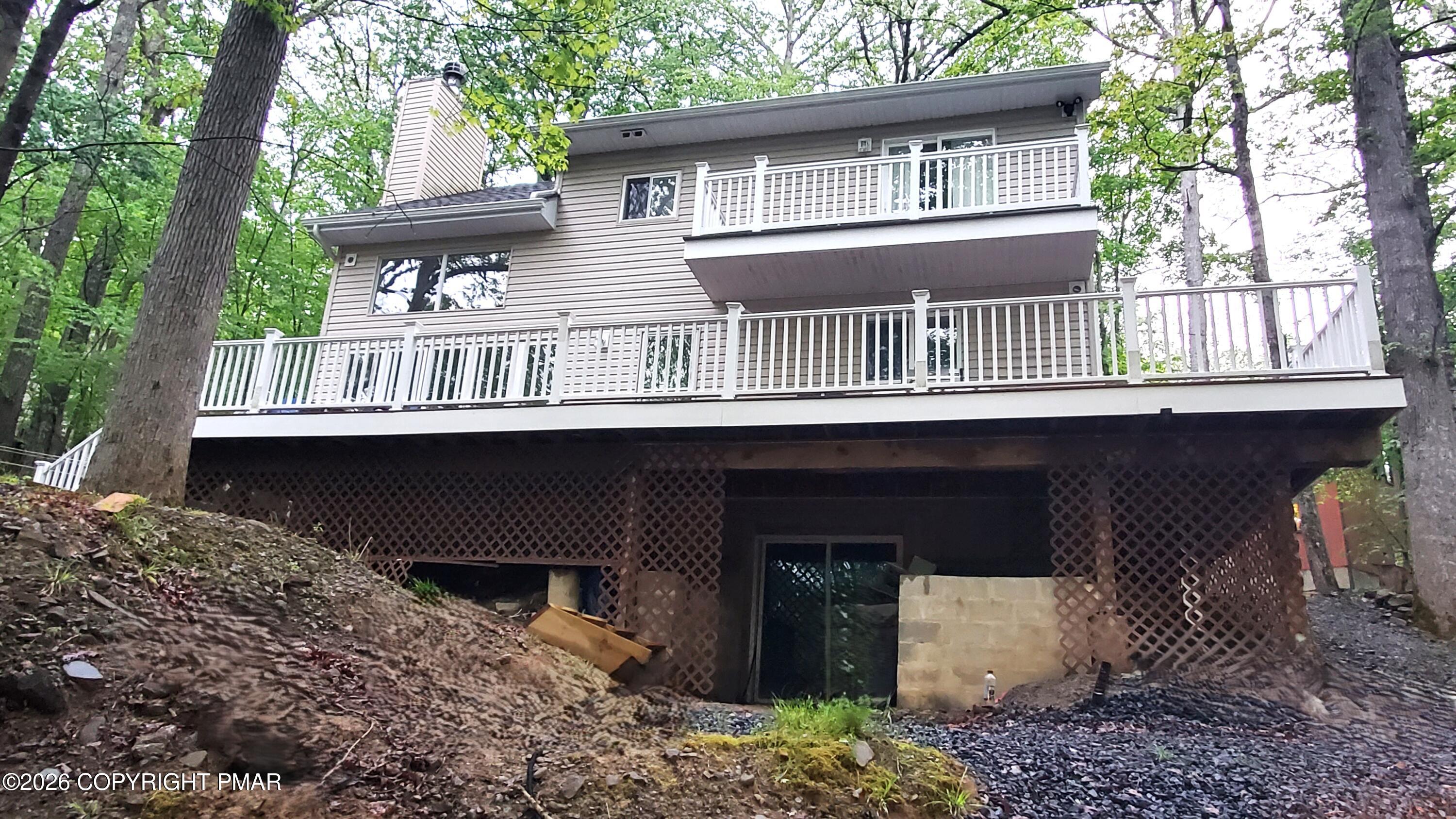5873 Decker Road Bushkill, PA 18324 - Photo 57 of 57 a front view of a house with a porch