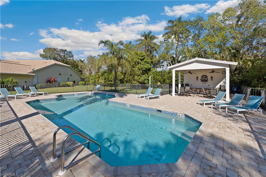 8526 Mustang Drive Naples, FL 34113 - Photo 20 of 24 View of pool featuring ceiling fan and a patio area