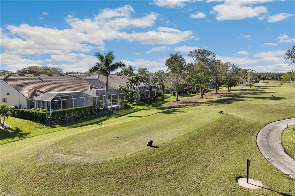 8526 Mustang Drive Naples, FL 34113 - Photo 22 of 24 View of property's community with a lawn