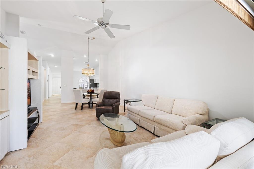 8526 Mustang Drive Naples, FL 34113 - Photo 7 of 24 Living area with recessed lighting, ceiling fan with notable chandelier, visible vents, and vaulted ceiling