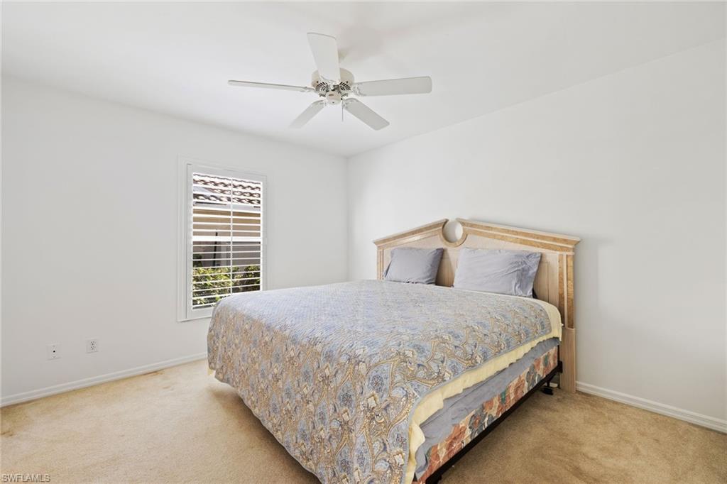 8526 Mustang Drive Naples, FL 34113 - Photo 9 of 24 Bedroom featuring baseboards, light colored carpet, and ceiling fan
