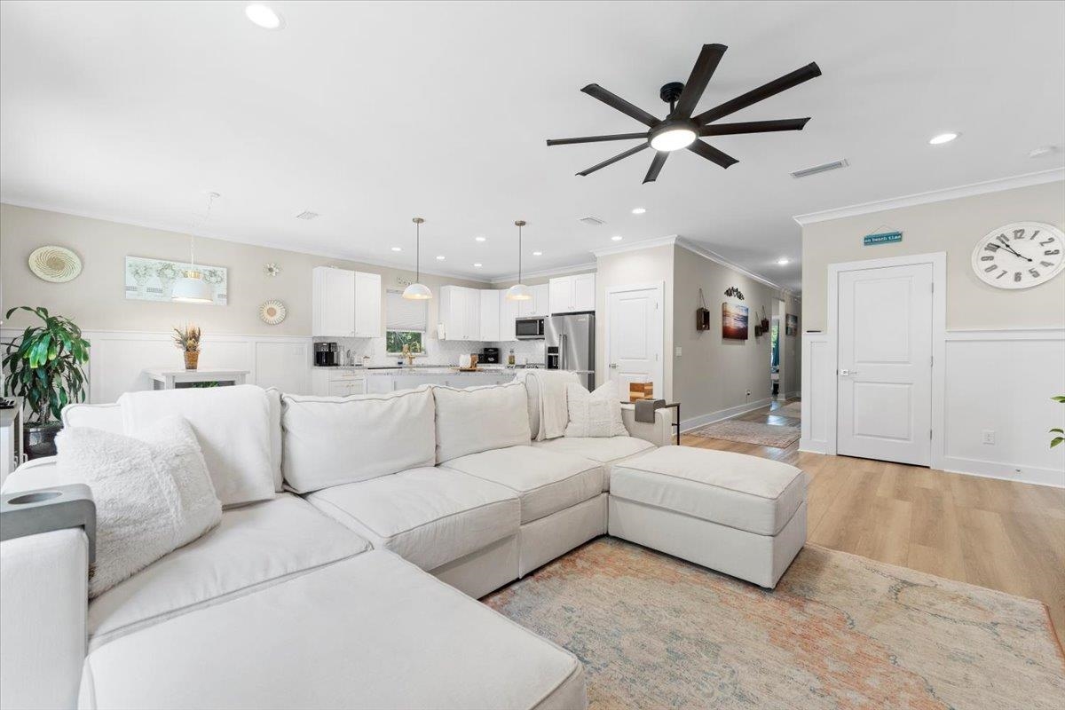 633 West Pope Road St. Augustine, FL 32080 - Photo 5 of 42 a living room with furniture kitchen view and a chandelier
