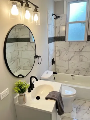 a bathroom with a sink and mirror