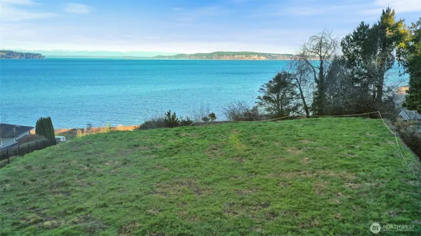 a view of a lake with a yard