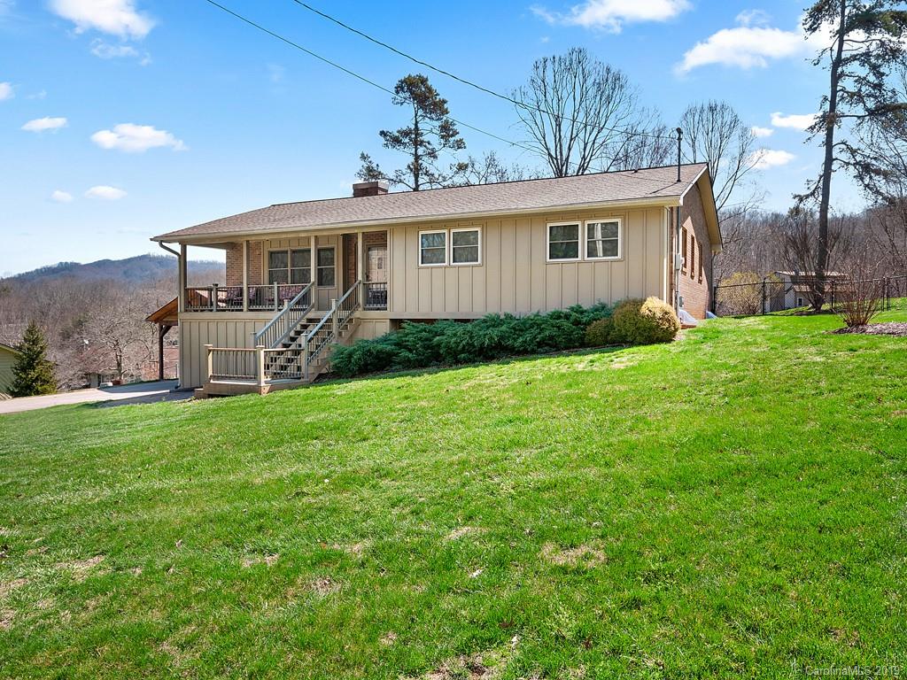 263 Stoney Brook Drive Clyde, NC 28721 - Photo 1 of 25 a view of a house with backyard and garden