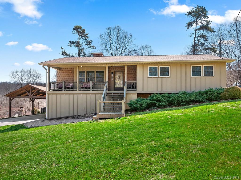 263 Stoney Brook Drive Clyde, NC 28721 - Photo 2 of 25 a front view of a house with a yard and porch