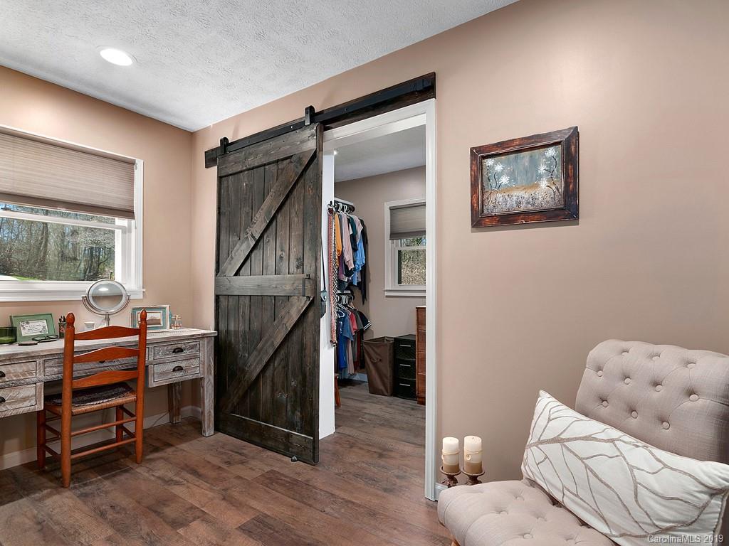 263 Stoney Brook Drive Clyde, NC 28721 - Photo 15 of 25 a room with furniture and a window