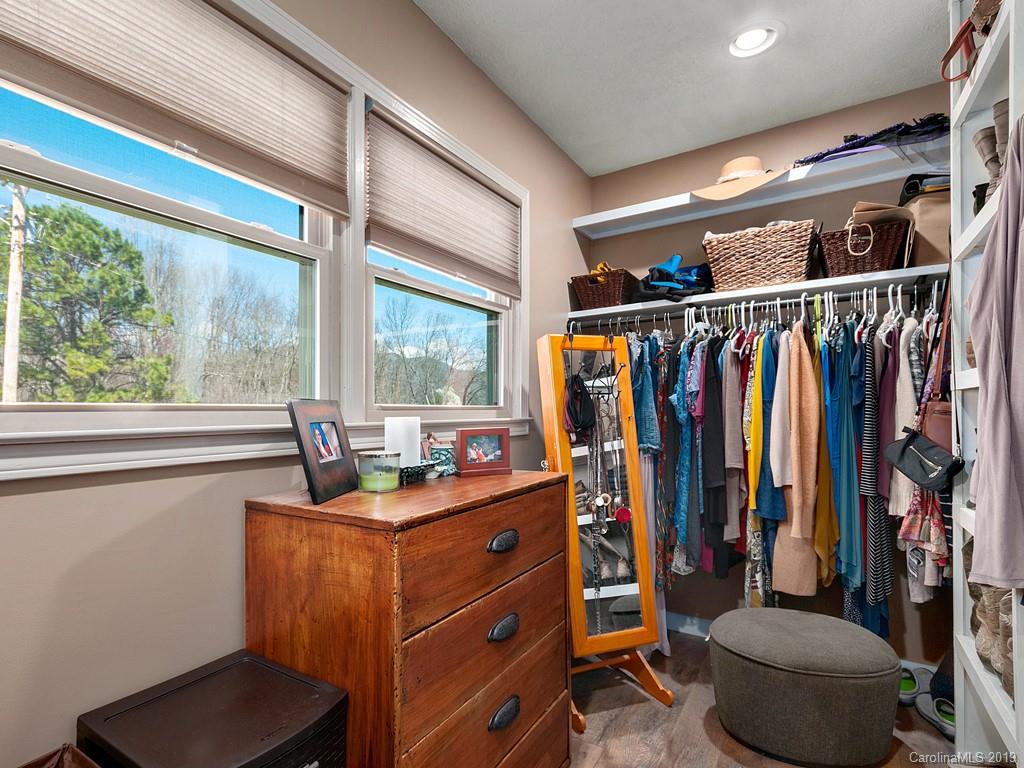 263 Stoney Brook Drive Clyde, NC 28721 - Photo 16 of 25 a view of walk in closet with clothes and shoes