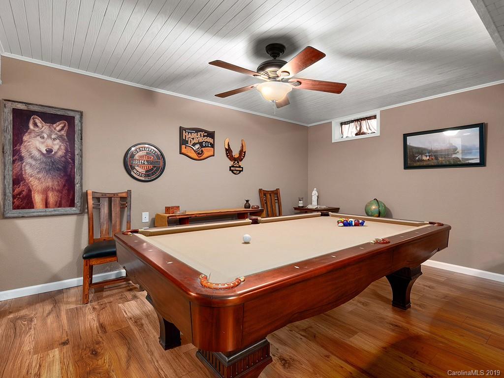 263 Stoney Brook Drive Clyde, NC 28721 - Photo 21 of 25 a room with pool table and paintings on the wall