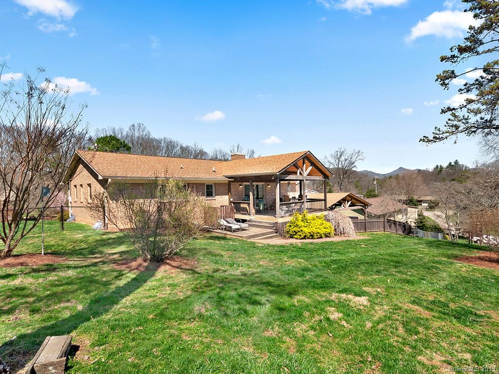 263 Stoney Brook Drive Clyde, NC 28721 - Photo 23 of 25 a view of a house with pool and a yard