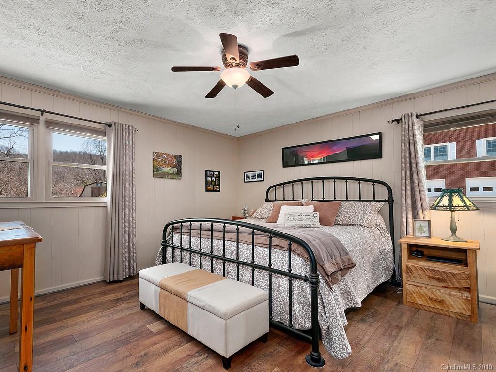 263 Stoney Brook Drive Clyde, NC 28721 - Photo 10 of 25 a bedroom with a bed and window