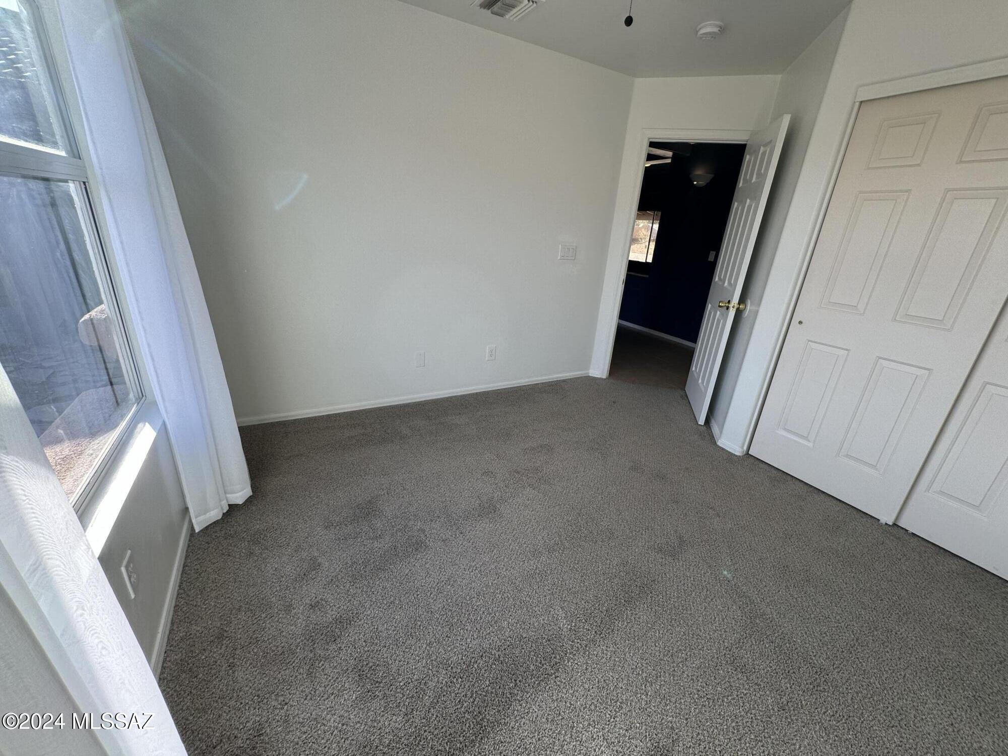 1841 America Court Rio Rico, AZ 85648 - Photo 10 of 38 a view of an empty room with a window