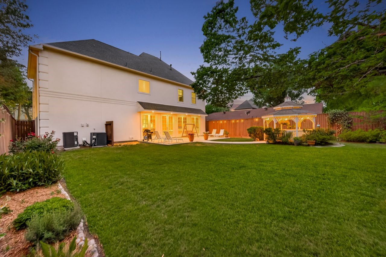 10932 Lasso Lane Houston, TX 77079 - Photo 33 of 38 a view of a house with a big yard