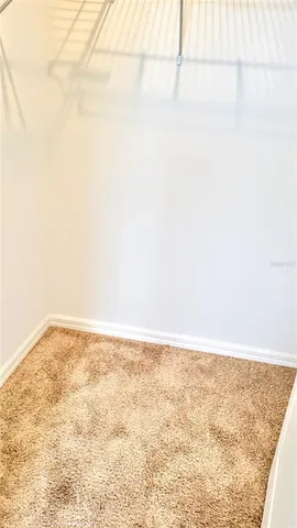 a bathroom with a granite countertop sink mirror vanity and toilet