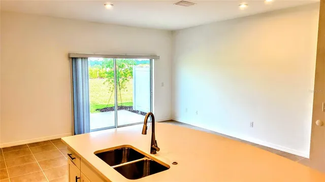 a front view of a house with a big yard