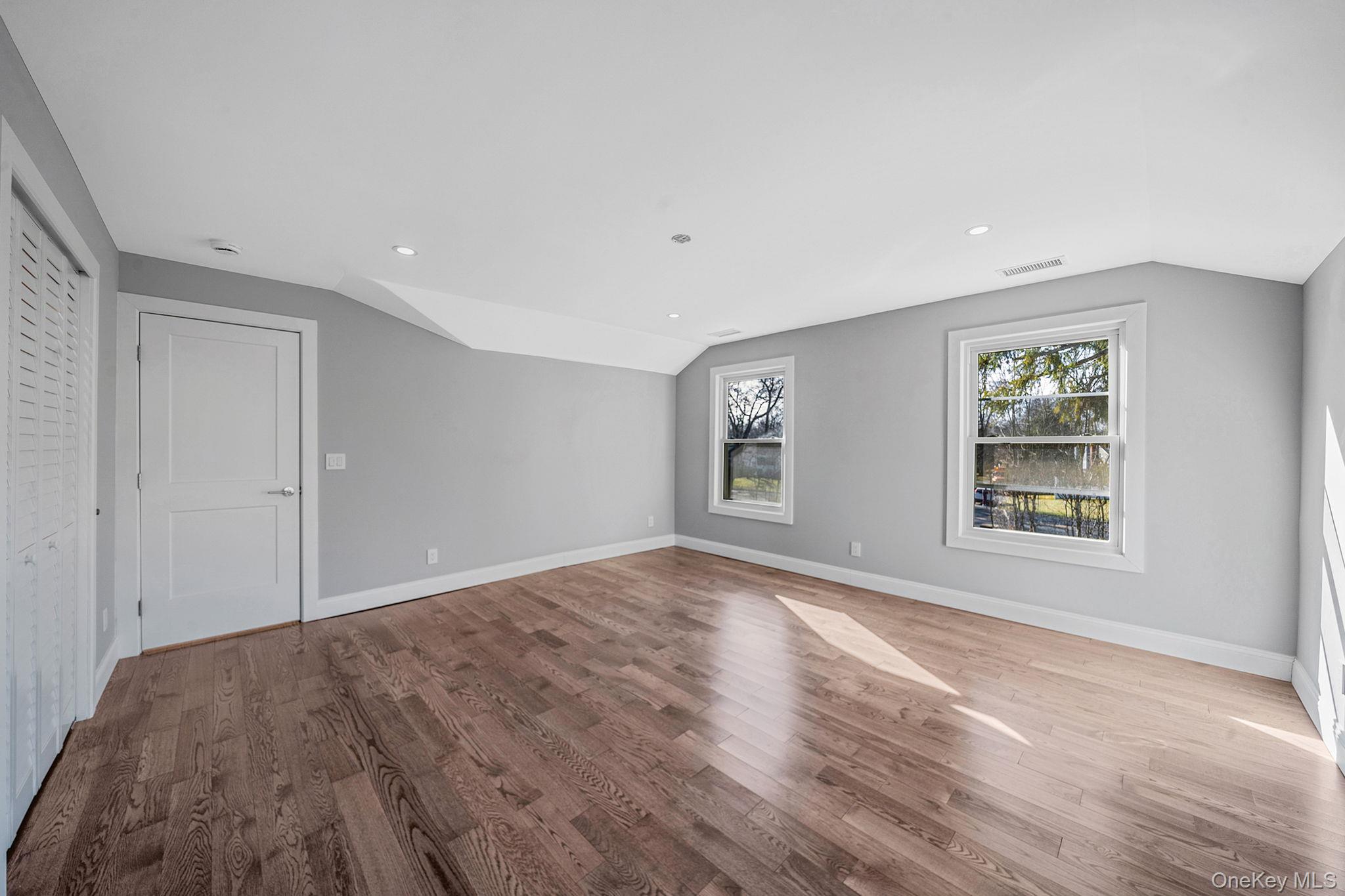 141 Wilmot Road Scarsdale, NY 10583 - Photo 21 of 49 Additional living space featuring lofted ceiling, light wood finished floors, and recessed lighting