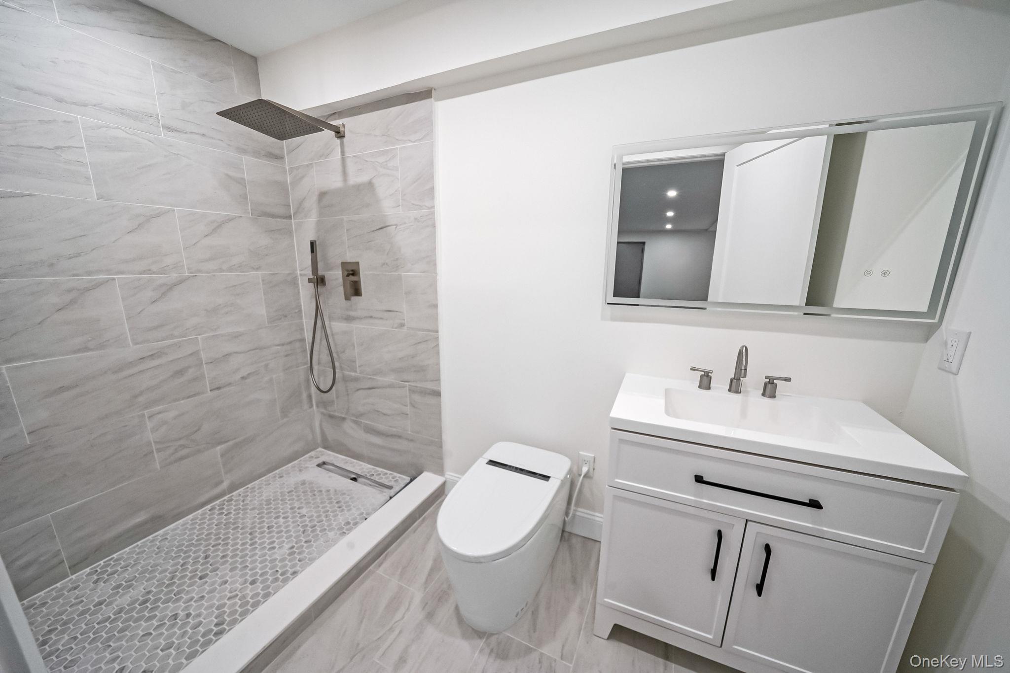 141 Wilmot Road Scarsdale, NY 10583 - Photo 39 of 49 Full bath with vanity and a tile shower