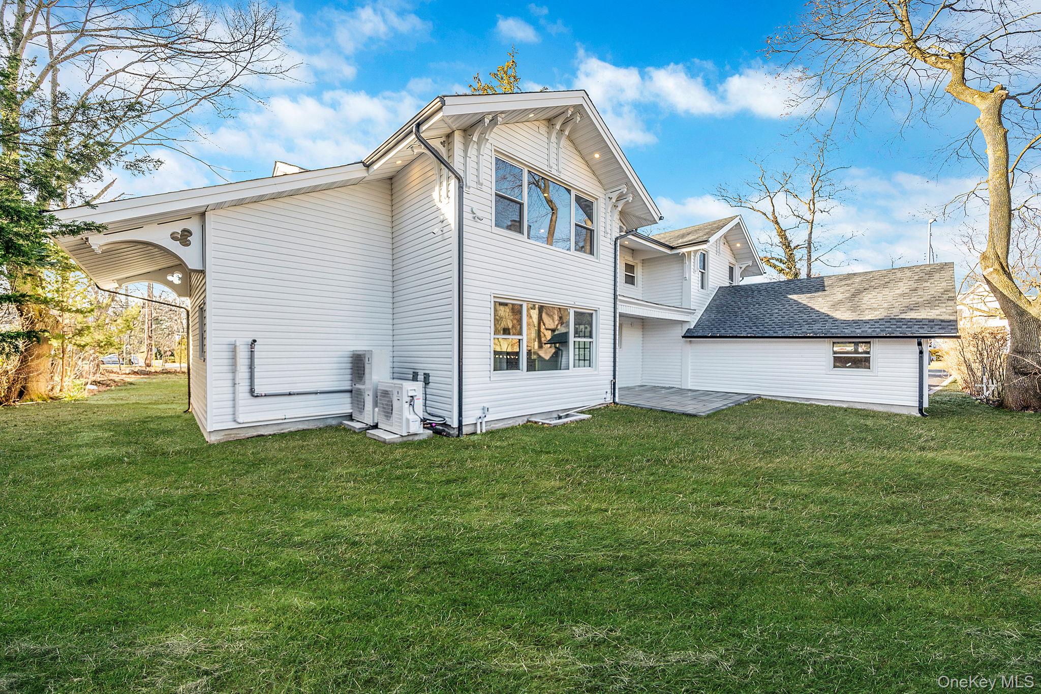 141 Wilmot Road Scarsdale, NY 10583 - Photo 41 of 49 Back of house with a yard