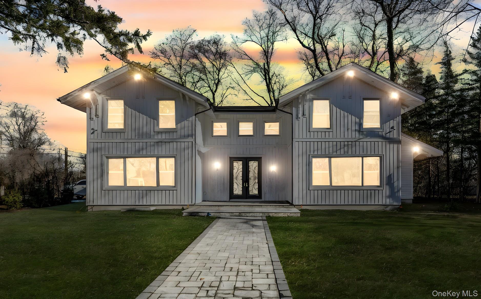 141 Wilmot Road Scarsdale, NY 10583 - Photo 44 of 49 View of front facade featuring a yard and french doors