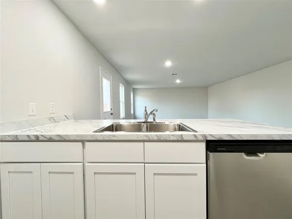 a kitchen with a sink and a cabinets