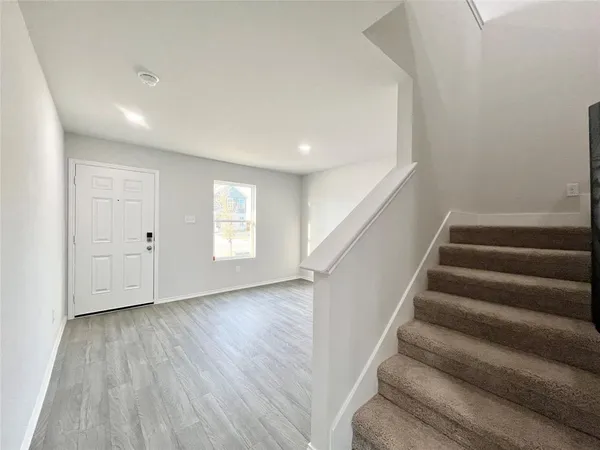 a view of entryway with wooden floor