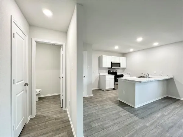 a view of kitchen with wooden floor