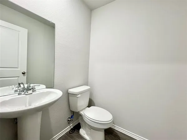 a bathroom with a sink and a toilet