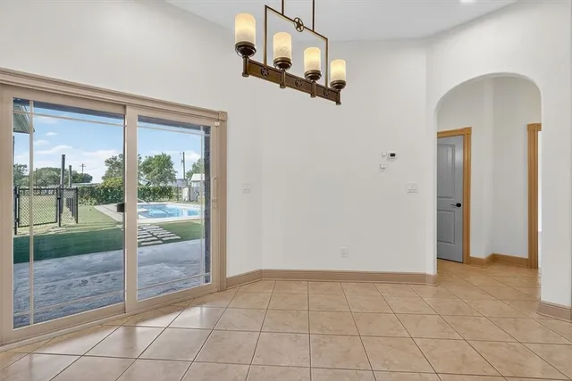 a view of an empty room and glass door