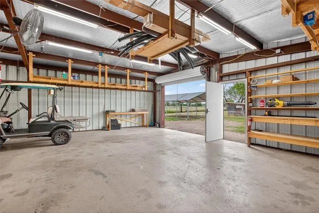 a view of parking garage with cars
