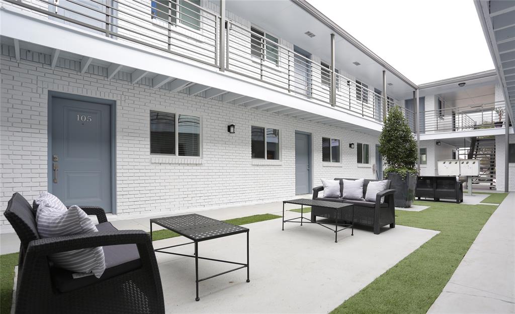 404 East 9th Street, Unit 4205 Dallas, TX 75203 - Photo 2 of 12 a backyard of a house with seating space