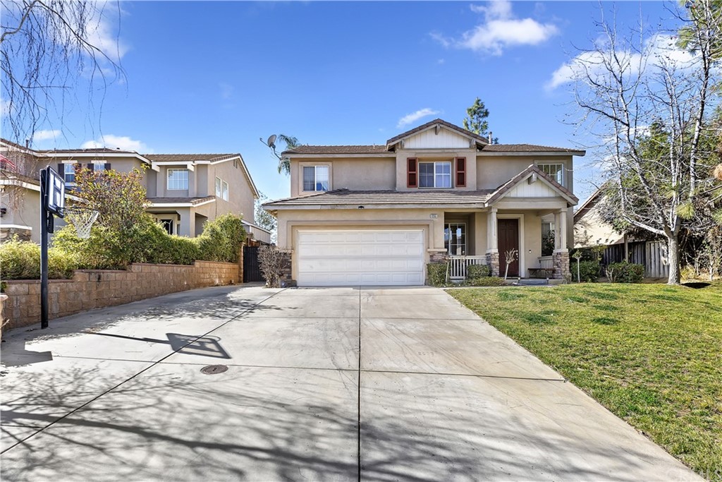 8355 Plainview Street Riverside, CA 92508 - Photo 1 of 1 a front view of a house with a garden and plants