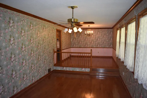 a view of entryway with wooden floor