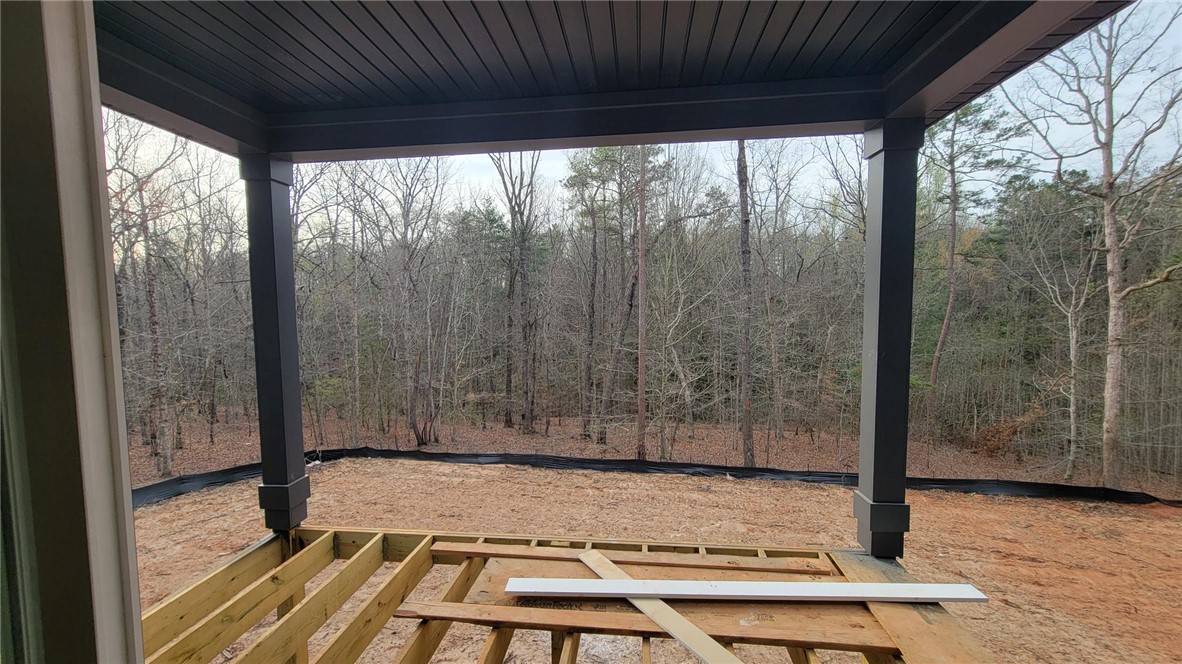 533 16th Circle Walhalla, SC 29691 - Photo 13 of 28 This spacious patio under construction provides a peaceful woodland retreat, perfect for relaxation and enjoying nature.