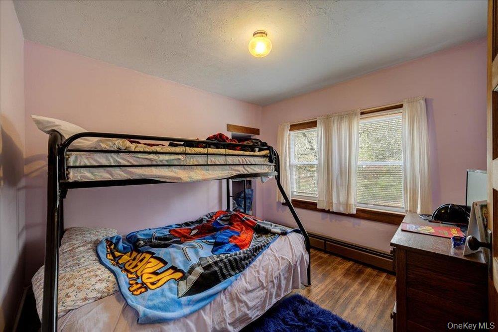 30 Walnut Mountain Road Liberty, NY 12754 - Photo 19 of 48 a bed sitting in a bedroom next to a window