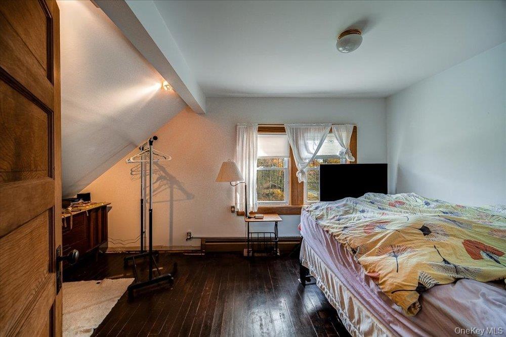 30 Walnut Mountain Road Liberty, NY 12754 - Photo 22 of 48 a bedroom with a bed and wooden floor