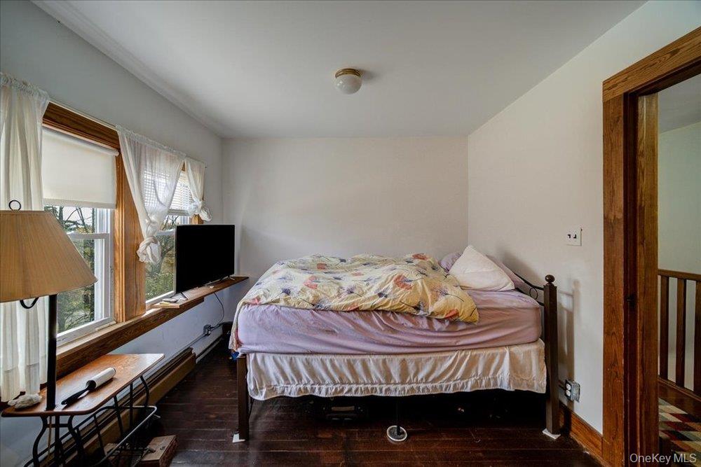 30 Walnut Mountain Road Liberty, NY 12754 - Photo 23 of 48 a bedroom with a bed and flat tv screen on the dresser