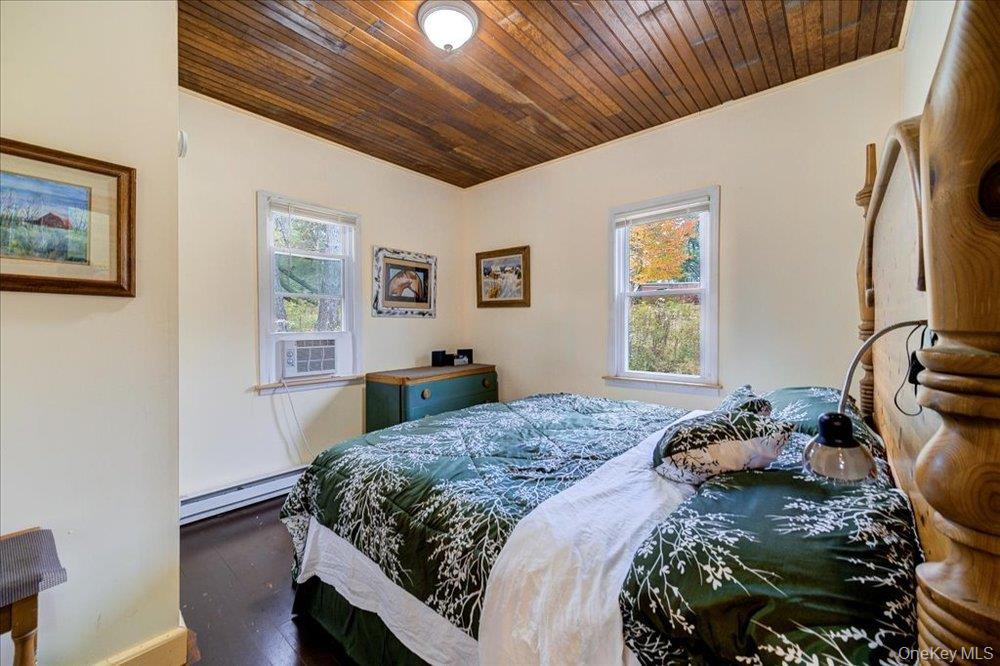 30 Walnut Mountain Road Liberty, NY 12754 - Photo 40 of 48 a bedroom with a bed and wooden floor
