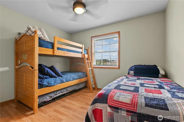 a bedroom with bed and a window