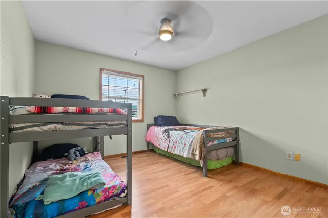 a room with a dresser and wooden floor
